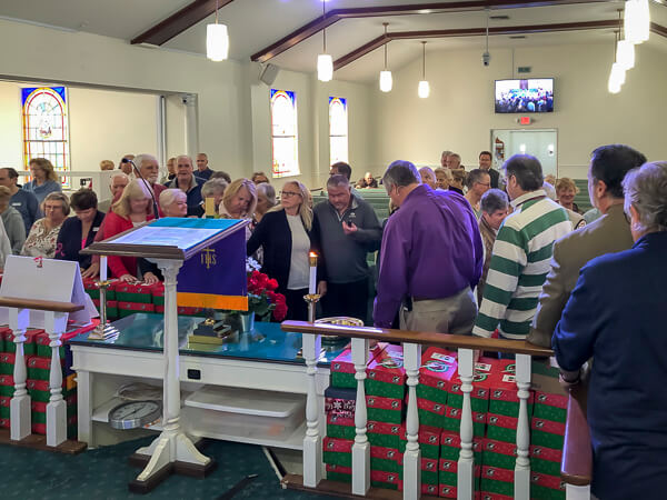 Congregation gathers to bless the Operation Christmas Child boxes