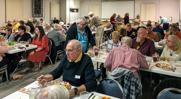 Large group of people enjoy Thanksgiving Dinner at Gulfview