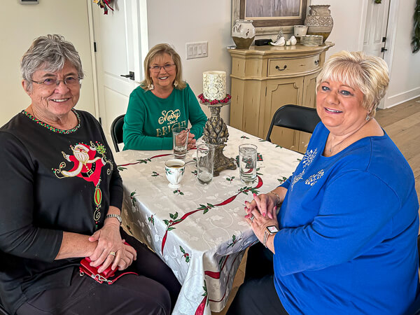 Three women sitting at a table