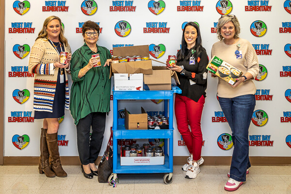 West Bay staff take delivery of UWF canned soup