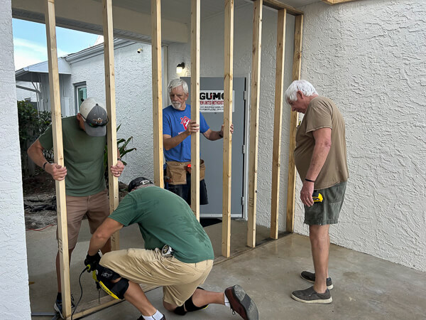 Men frame up a storage room.