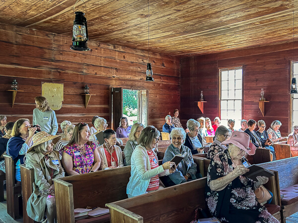 Women gather at historic Moss Hill church for memorial service.
