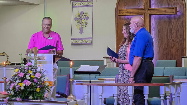 Pastor Brad commissions two new Stephen Ministry directors.