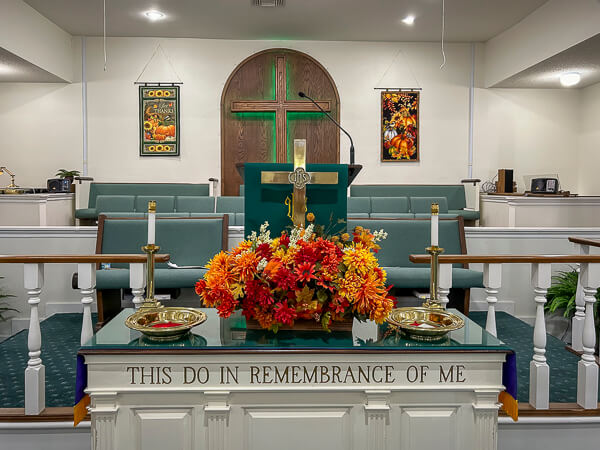 Autumn banners, sewn by the Seaside Stitchers, hang behind the choir loft in the sanctuary.