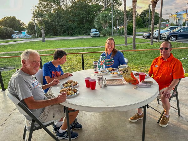 University of Florida fans sit at table