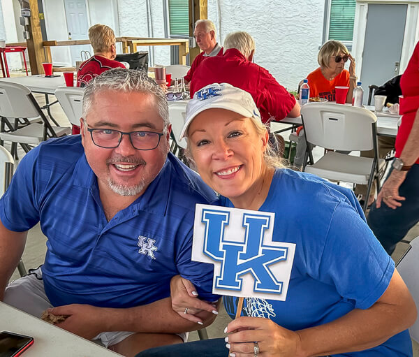 Cute couple represents Kentucky at outdoor dinner.