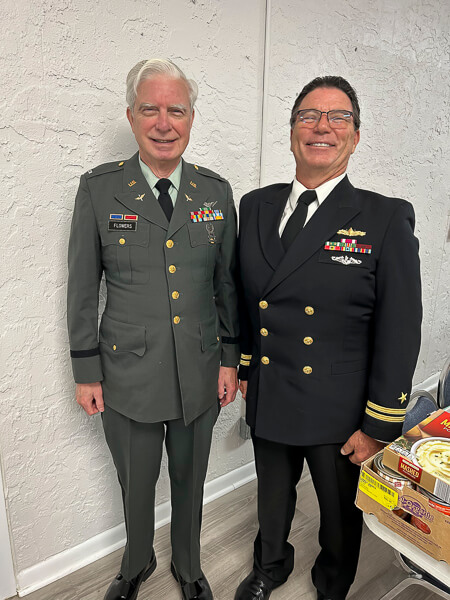 Two men wear their military uniforms on Veteran's Day