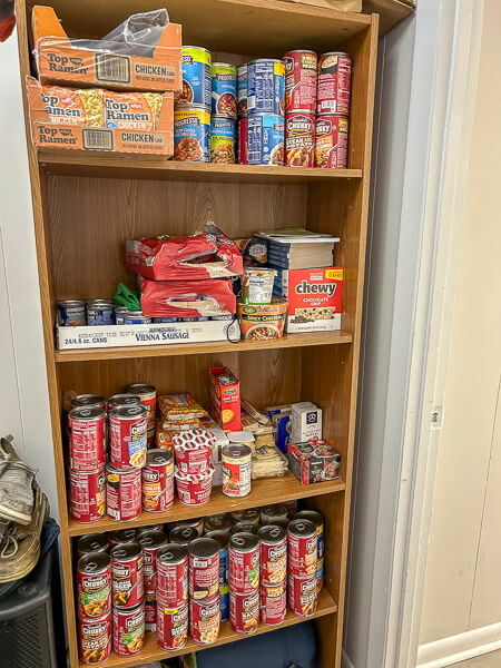 Cans of soup in bookshelf from UMW project.