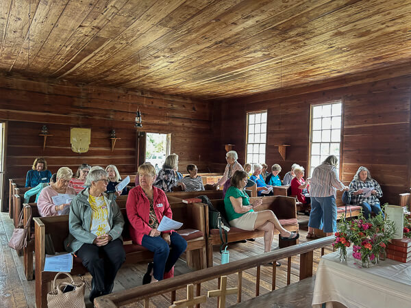 Women gather inside the church at Moss Hill