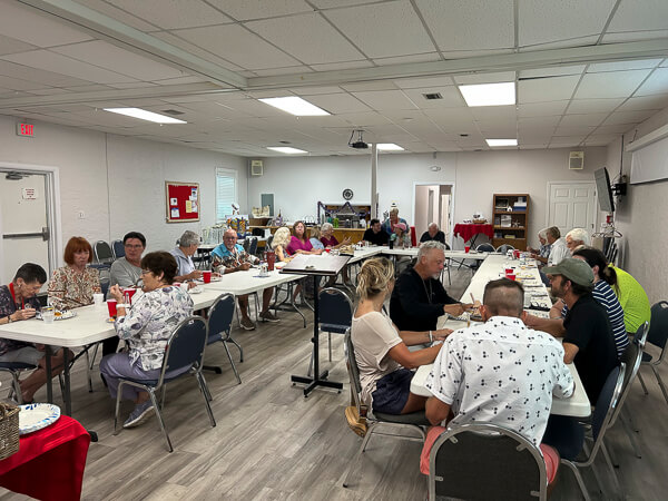 Group of people eat at Emmaus Walk Dinner