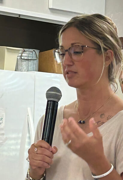 Woman speaks at Emmaus Walk Dinner