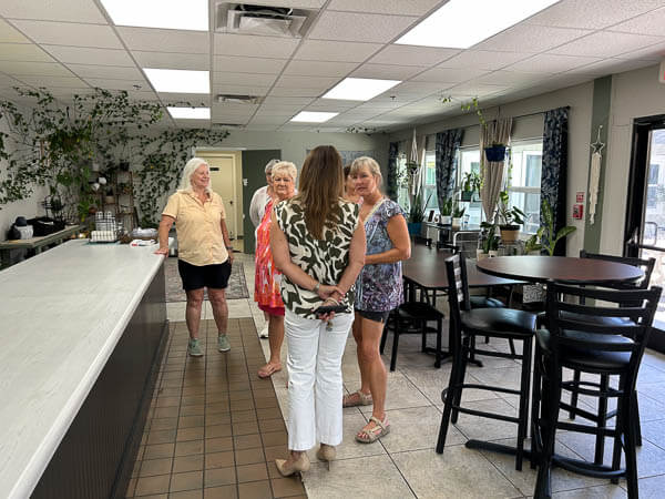 Ladies talk in a kitchen area