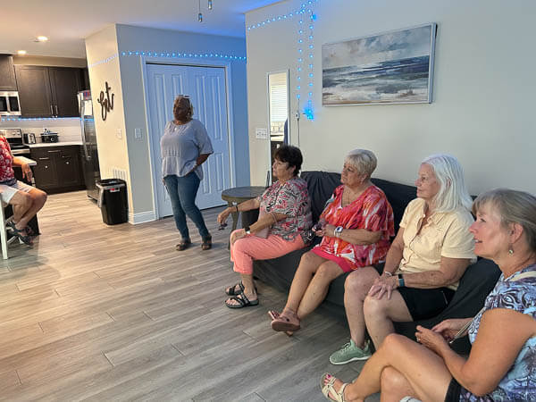 Ladies sit and listen to a speaker