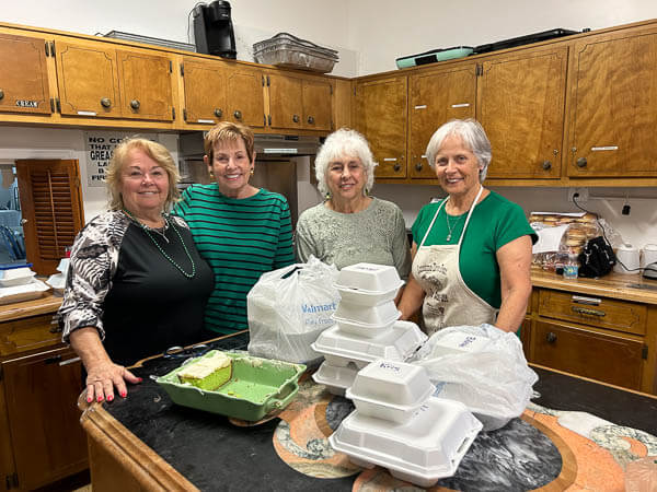 Ladies stand in church kitchen