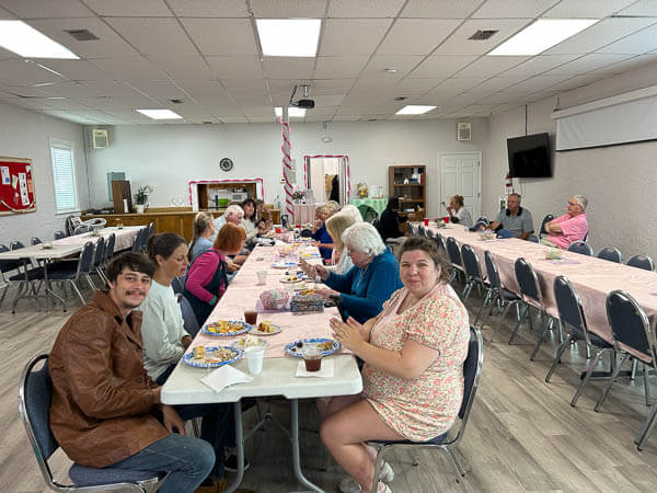 People eat in fellowship hall