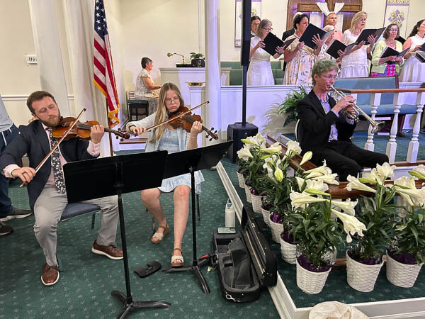 A few people play musical instruments on Easter